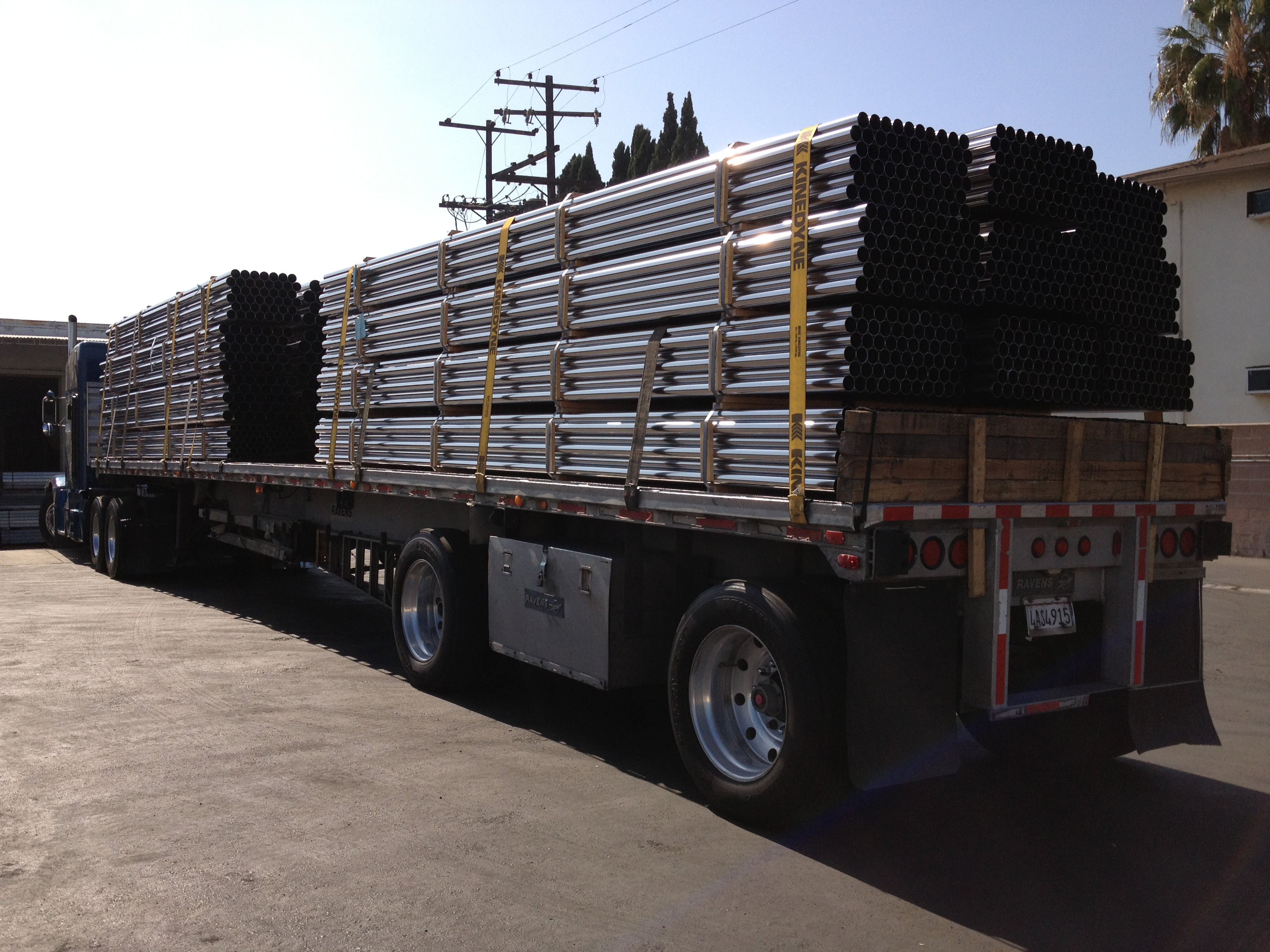 Loaded flatbed truck ready to deliver stainless steel tubes